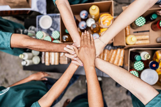 Volunteers with hands stacked together at a BSK Foundation donation event